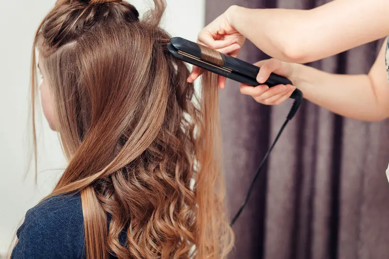 Curling hair with flat iron